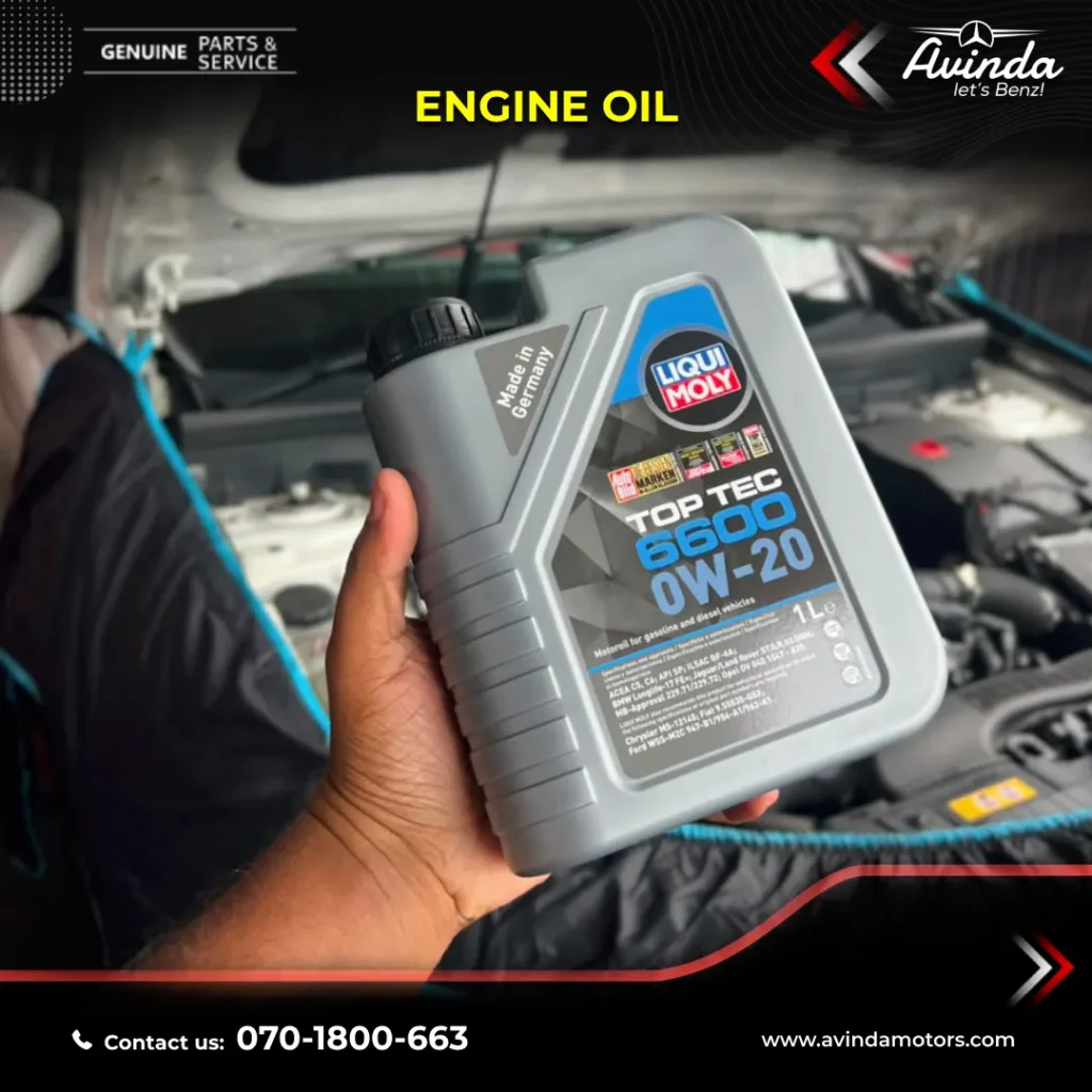 Auto technician checking fluid condition using an engine oil dipstick at a repair center