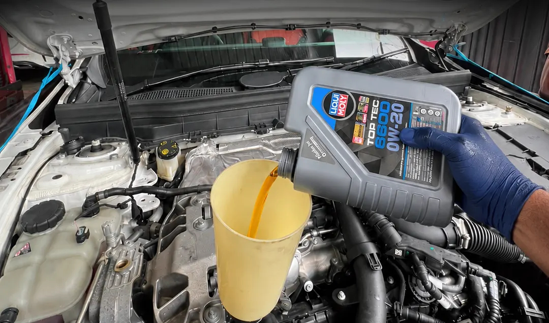 Expert mechanics performing comprehensive European auto diagnostics and routine oil change care